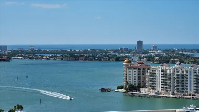 a view of a lake with a big yard