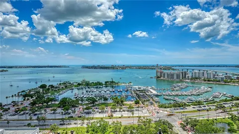 a kitchen with a sink and a stove top oven