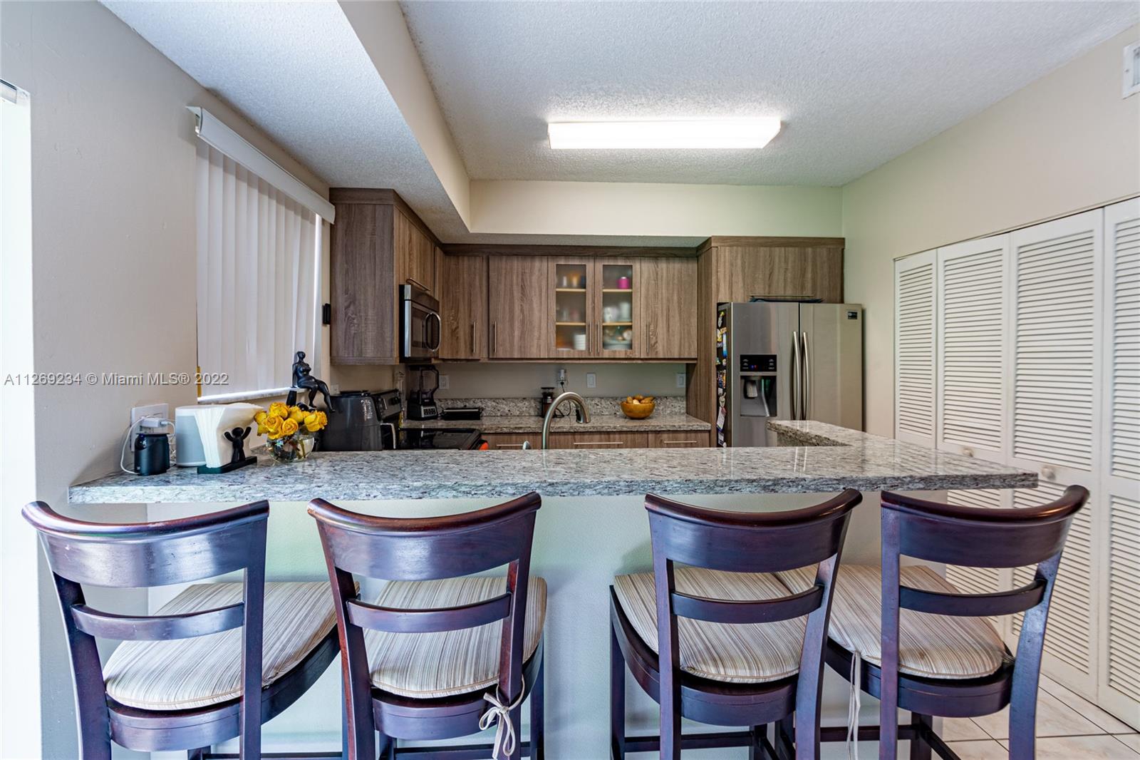 Doral Doral, FL 33178 - Photo 11 of 25 a kitchen with a dining table and chairs