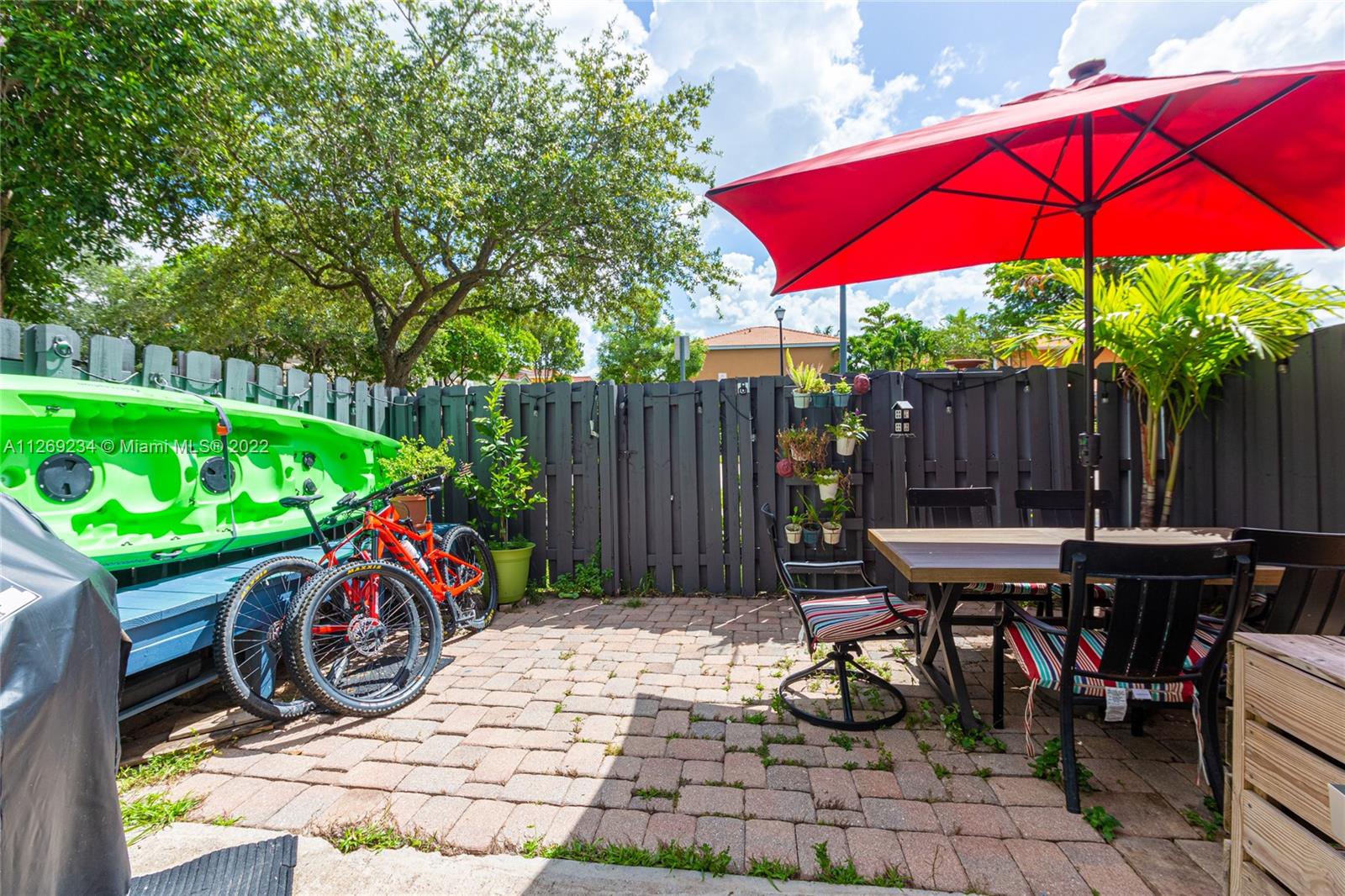 Doral Doral, FL 33178 - Photo 14 of 25 a view of outdoor sitting area with furniture and wooden fence