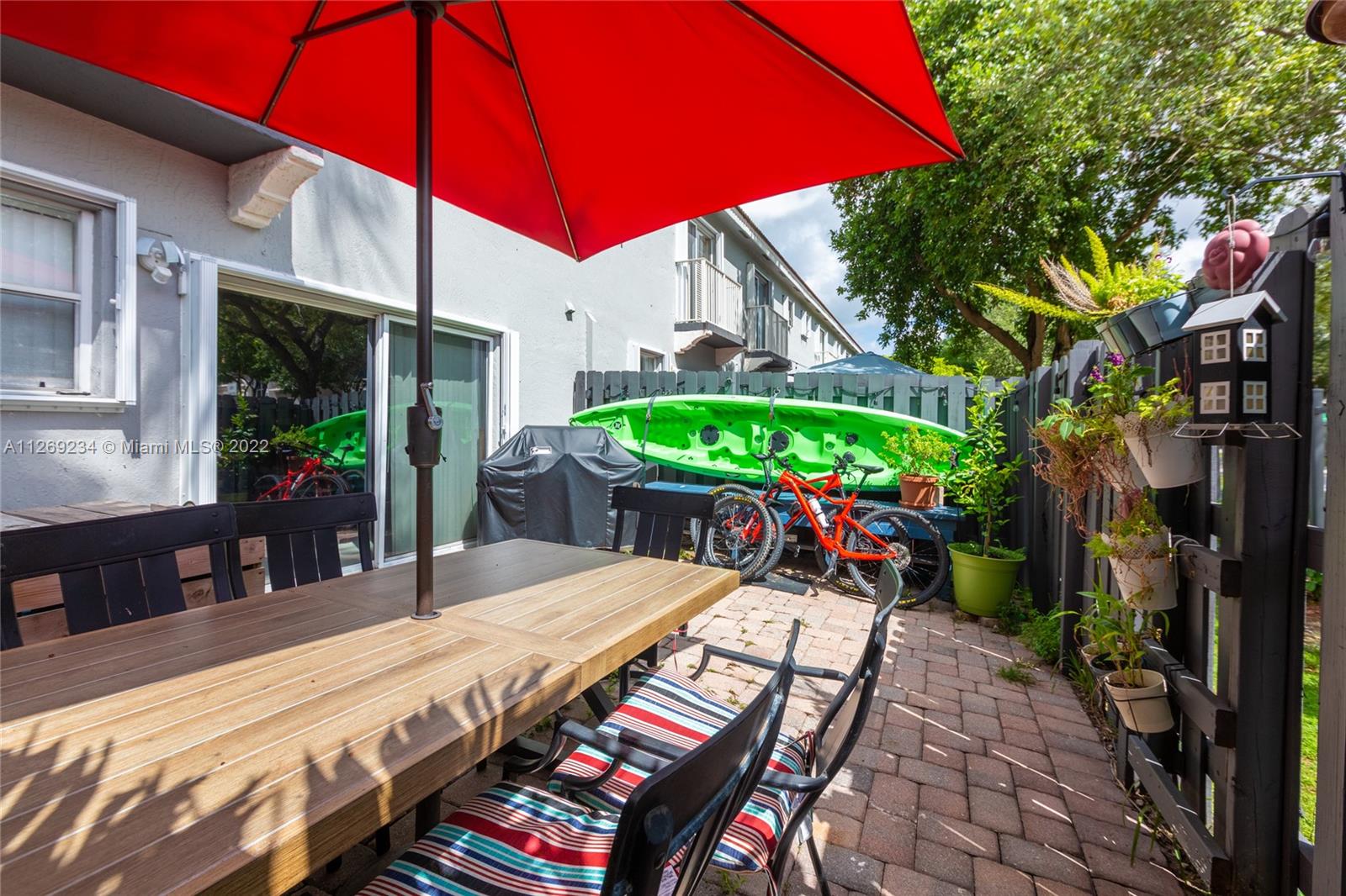 Doral Doral, FL 33178 - Photo 15 of 25 a view of a patio with table and chairs potted plants