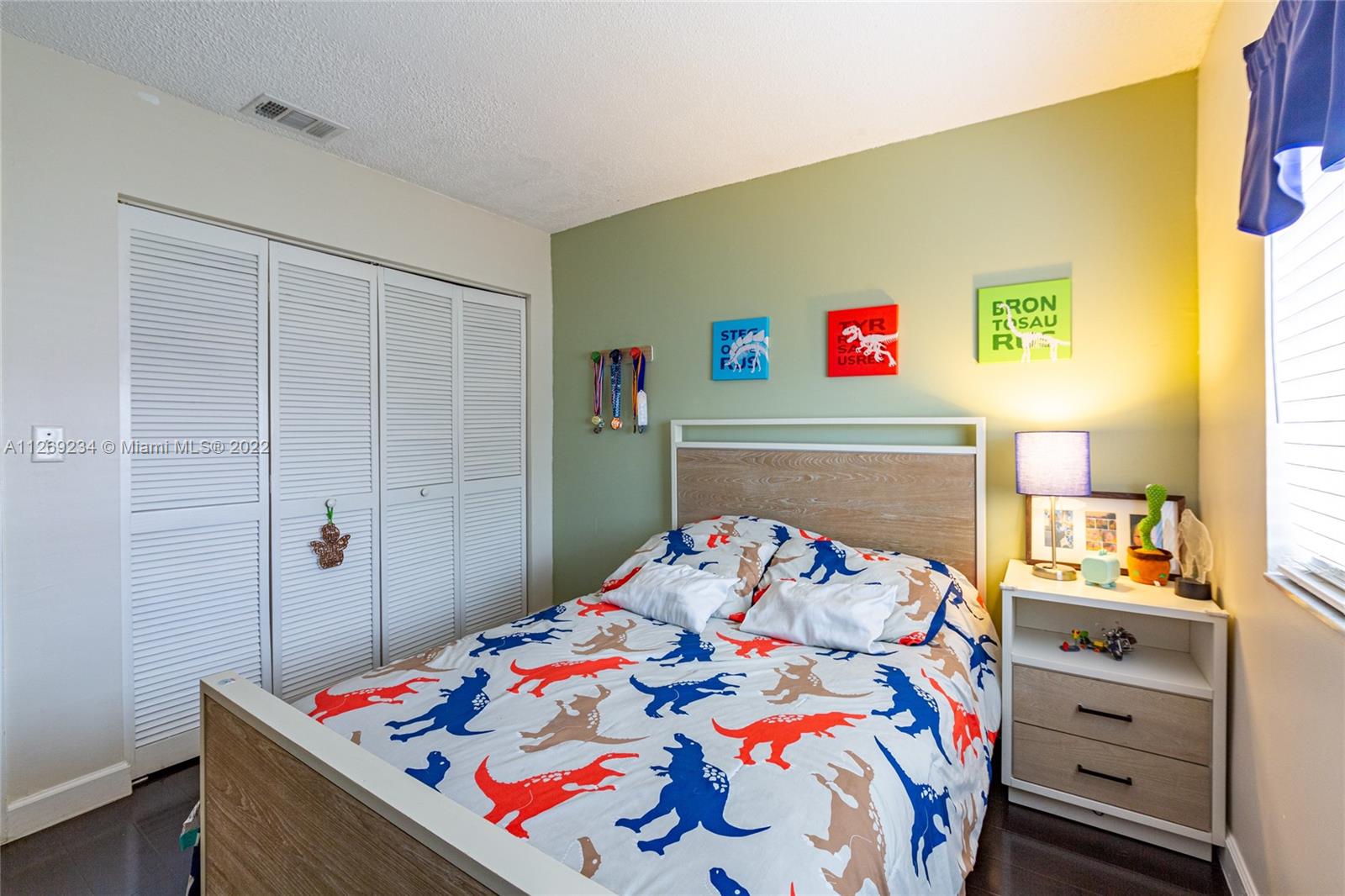 Doral Doral, FL 33178 - Photo 18 of 25 a bedroom with a bed and a dresser in it