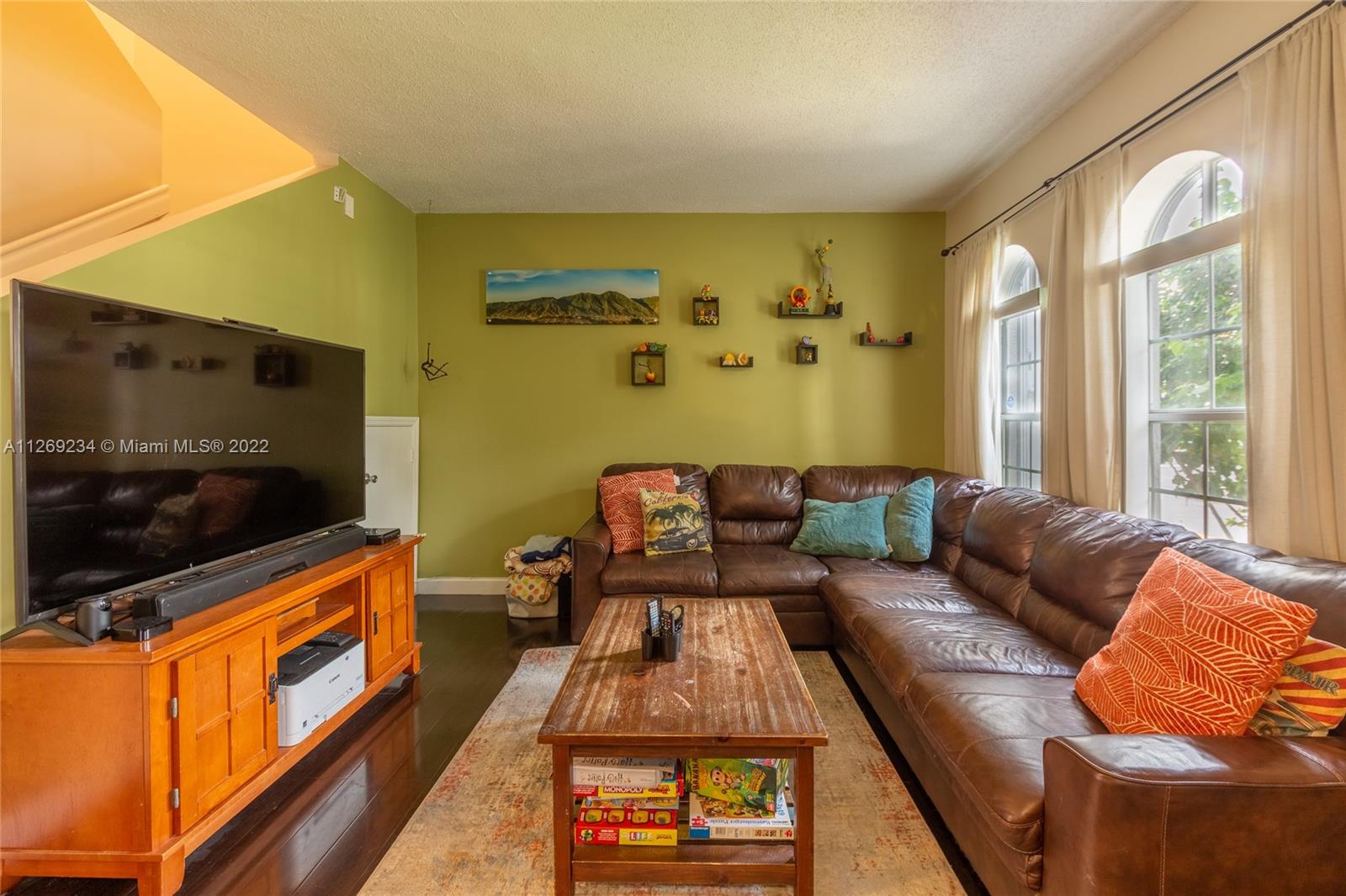 Doral Doral, FL 33178 - Photo 6 of 25 a living room with furniture and a flat screen tv