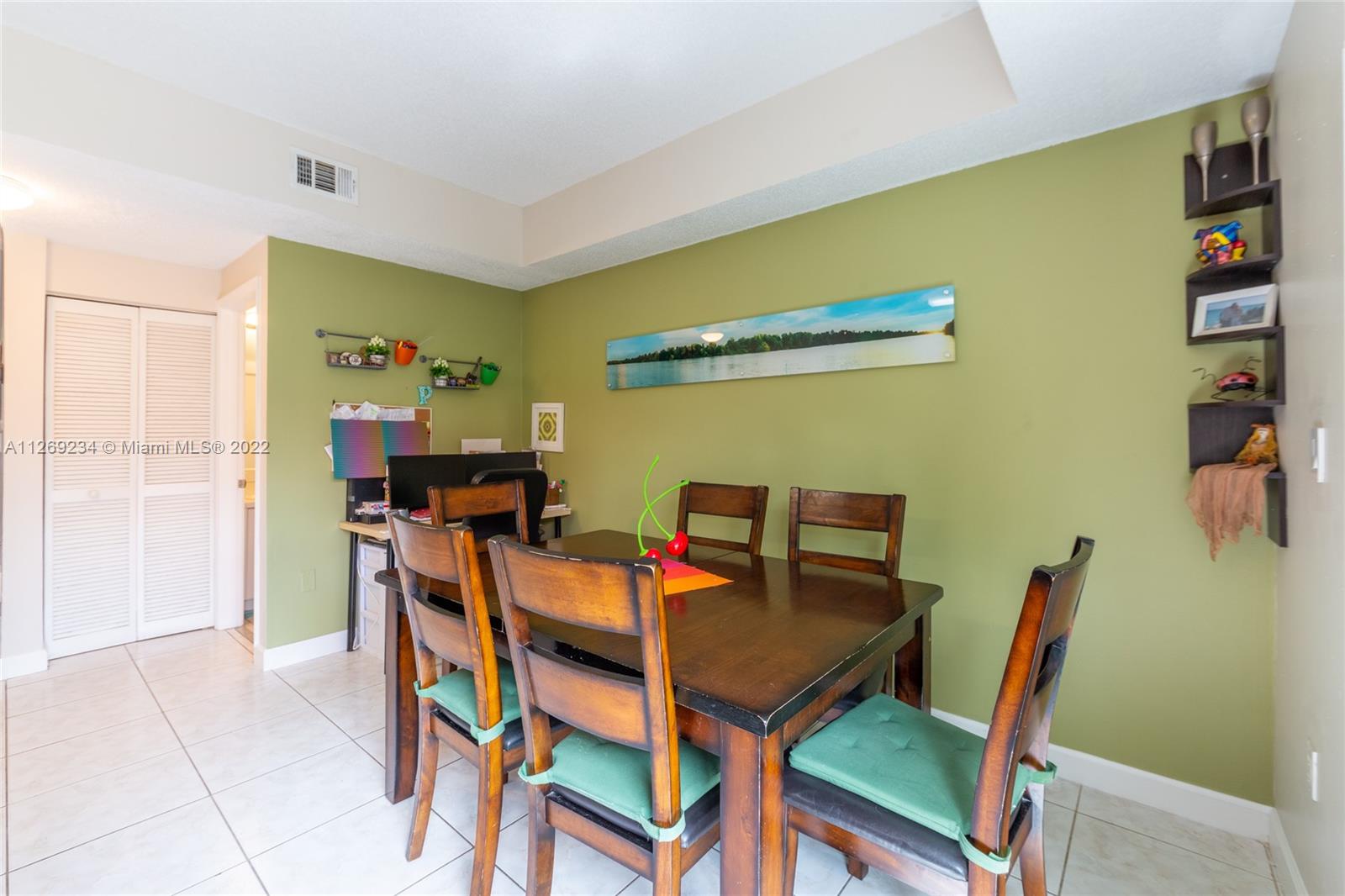 Doral Doral, FL 33178 - Photo 9 of 25 a view of a dining room with furniture and a table in it