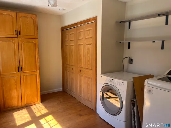 a view of a storage & utility room with washer and dryer