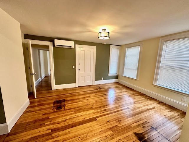 37 Gordon Street, Unit 1 Waltham, MA 02453 - Photo 7 of 12 wooden floor in an empty room with a window