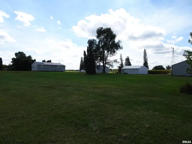 a view of a big yard with a house