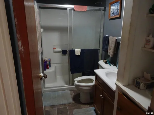 a bathroom with a toilet and a sink