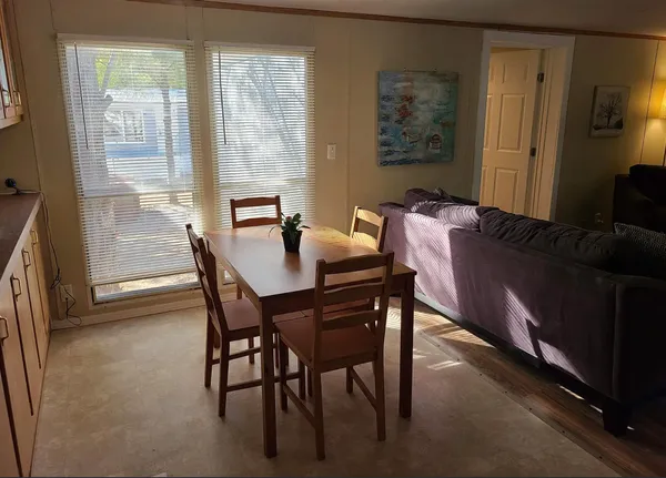 a bed room with a bed and a chair