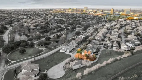 an aerial view of a residential houses with outdoor space