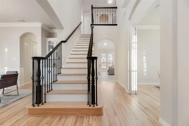 a view of entryway and hall with wooden floor