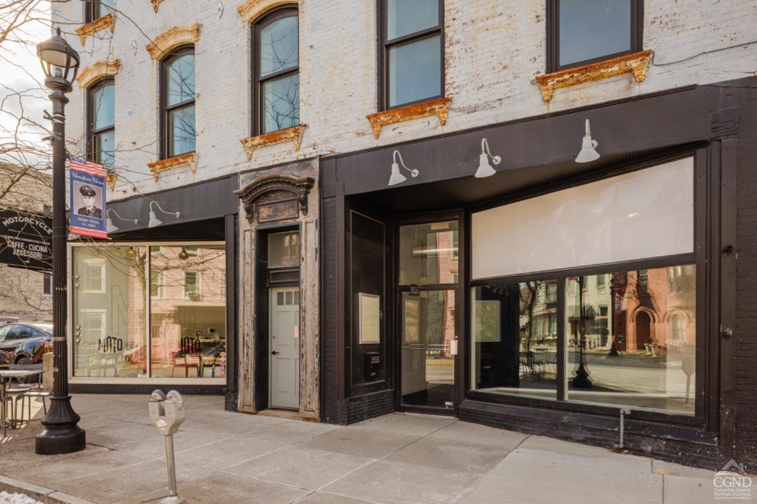 a view of a building with a glass door