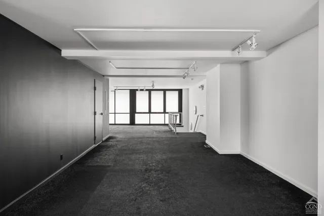 a view of an empty room with a window