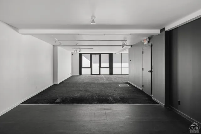 a view of an empty room with stairs
