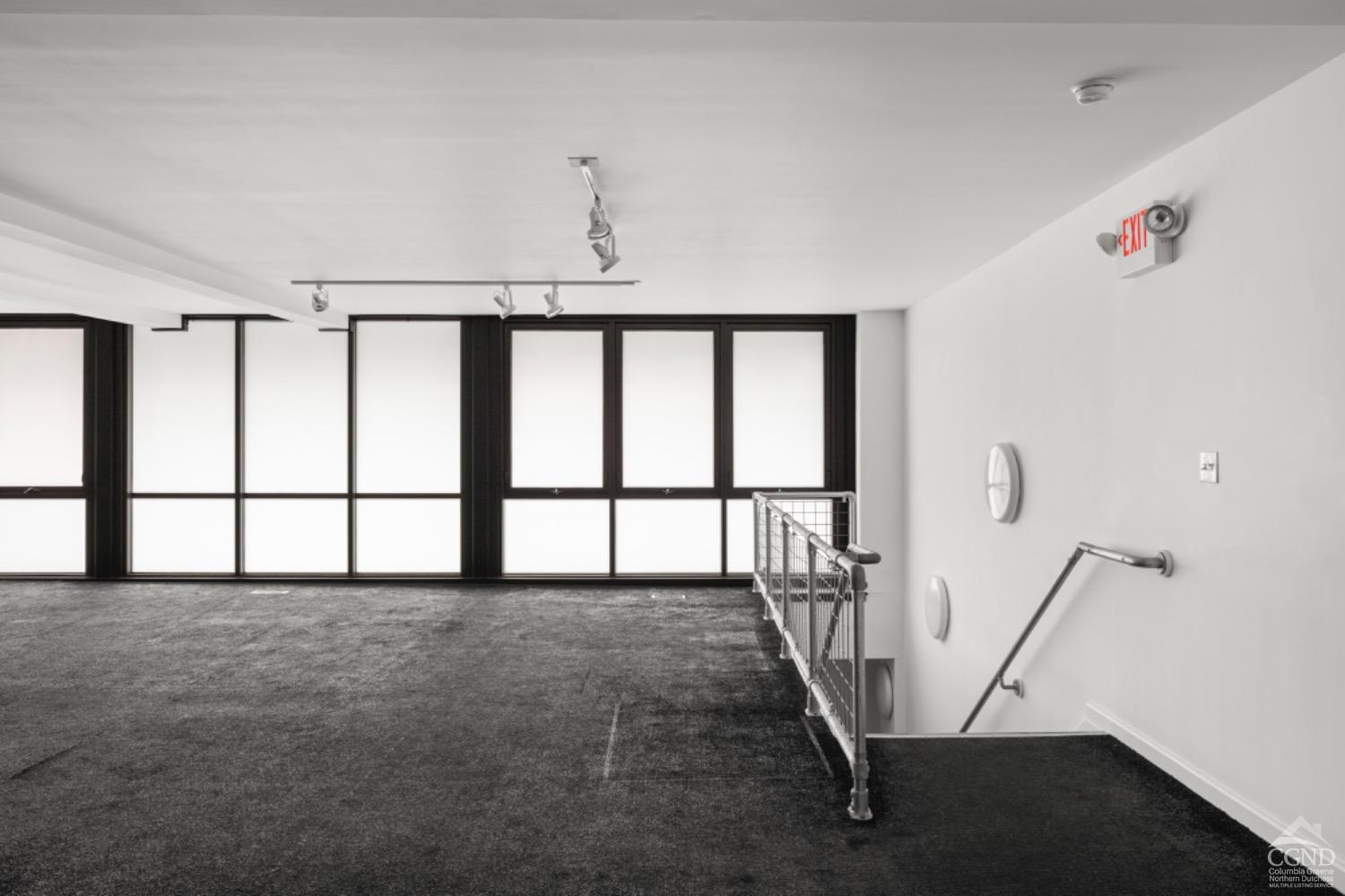 355 Warren Street Hudson, NY 12534 - Photo 13 of 16 a view of an empty room with stairs