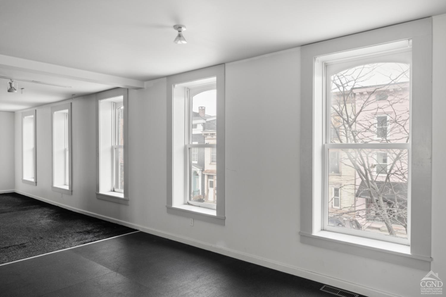 355 Warren Street Hudson, NY 12534 - Photo 9 of 16 a view of an empty room with a window