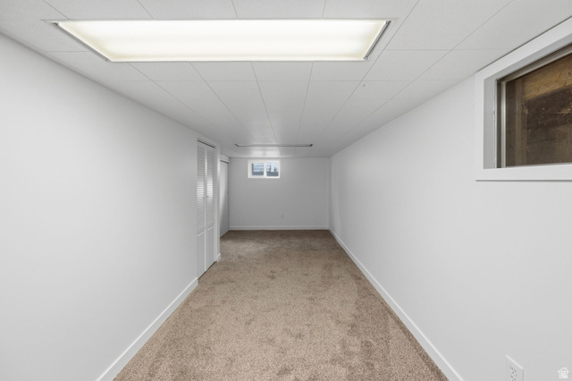 708 9th Street Ogden, UT 84404 - Photo 16 of 17 Corridor with baseboards and light colored carpet
