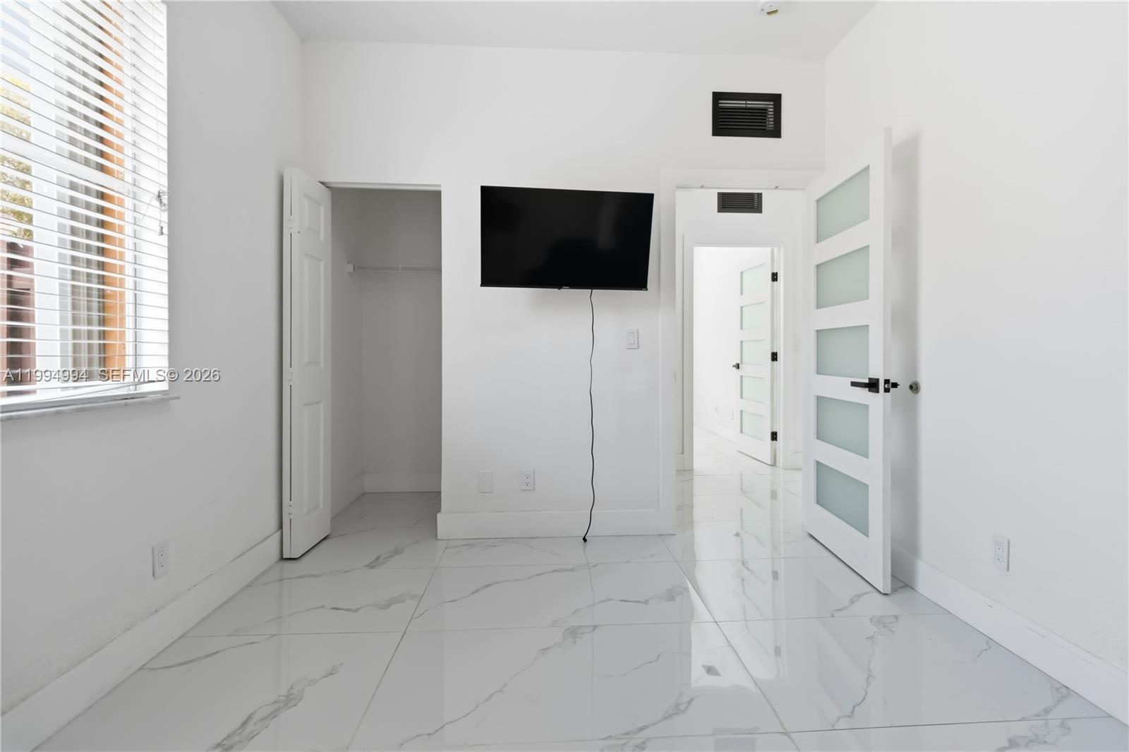 64 Southwest 15th Terrace Homestead, FL 33030 - Photo 20 of 26 a view of a livingroom with an empty space