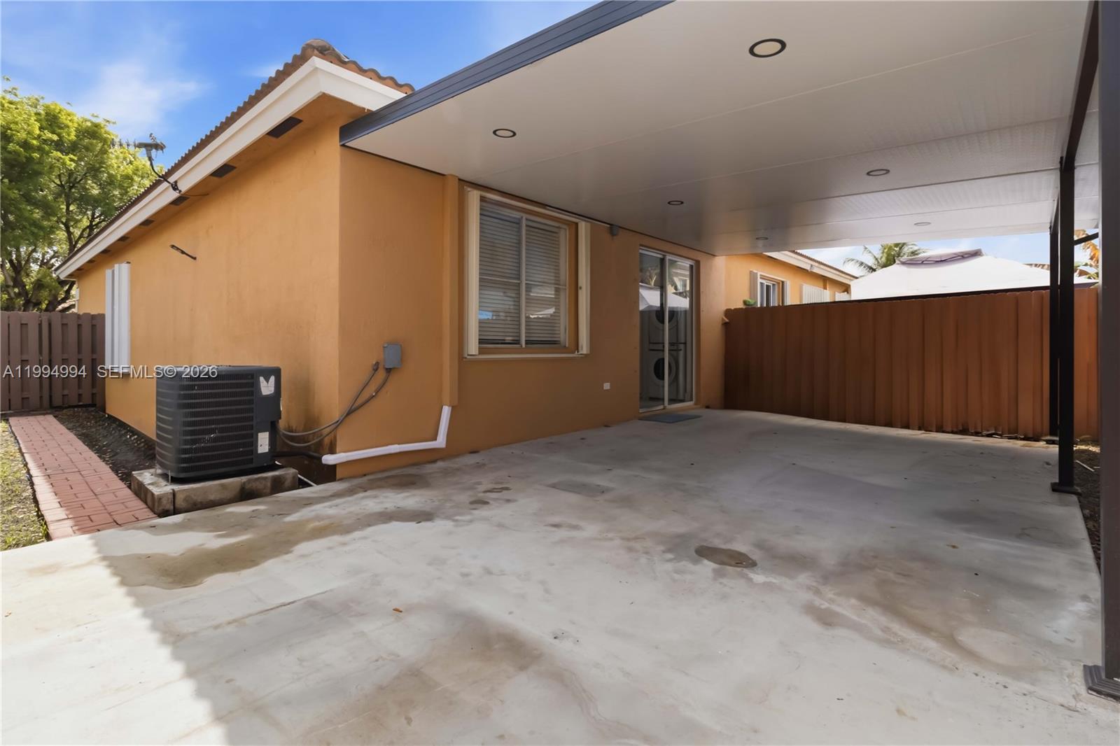 64 Southwest 15th Terrace Homestead, FL 33030 - Photo 21 of 26 a view of an empty room with wooden walls