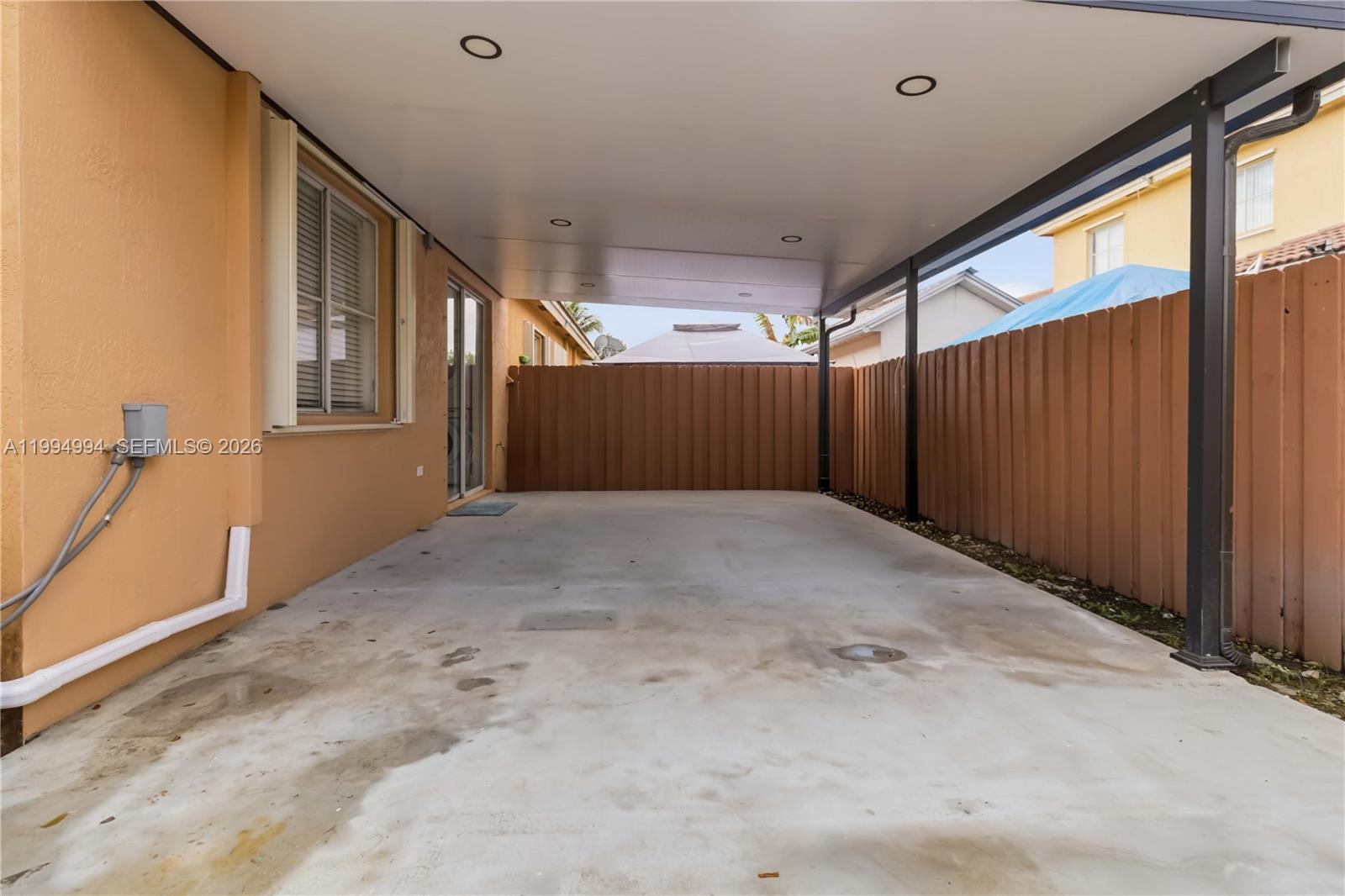 64 Southwest 15th Terrace Homestead, FL 33030 - Photo 25 of 26 a view of an empty room