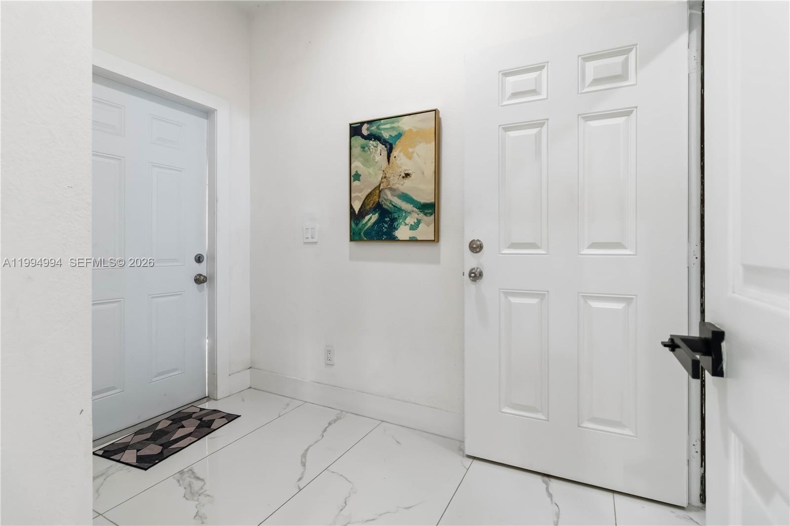 64 Southwest 15th Terrace Homestead, FL 33030 - Photo 7 of 26 a view of room with front door