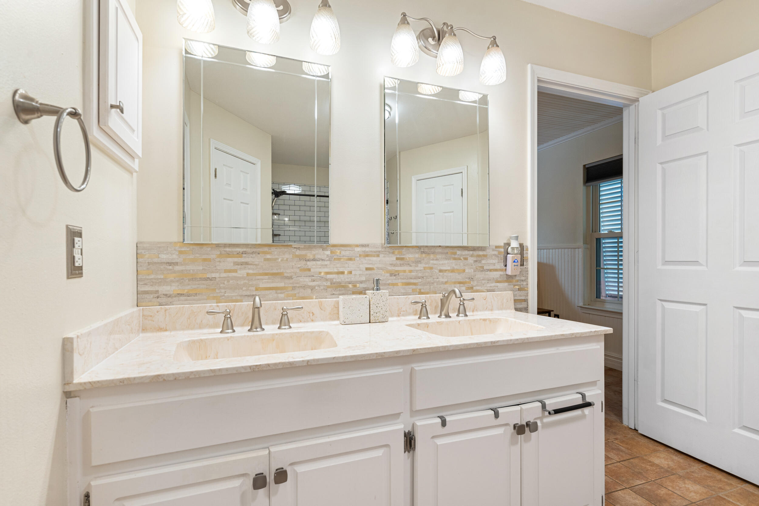 2852 Atoka Trail Crestview, FL 32539 - Photo 21 of 43 a bathroom with a sink double vanity and a mirror