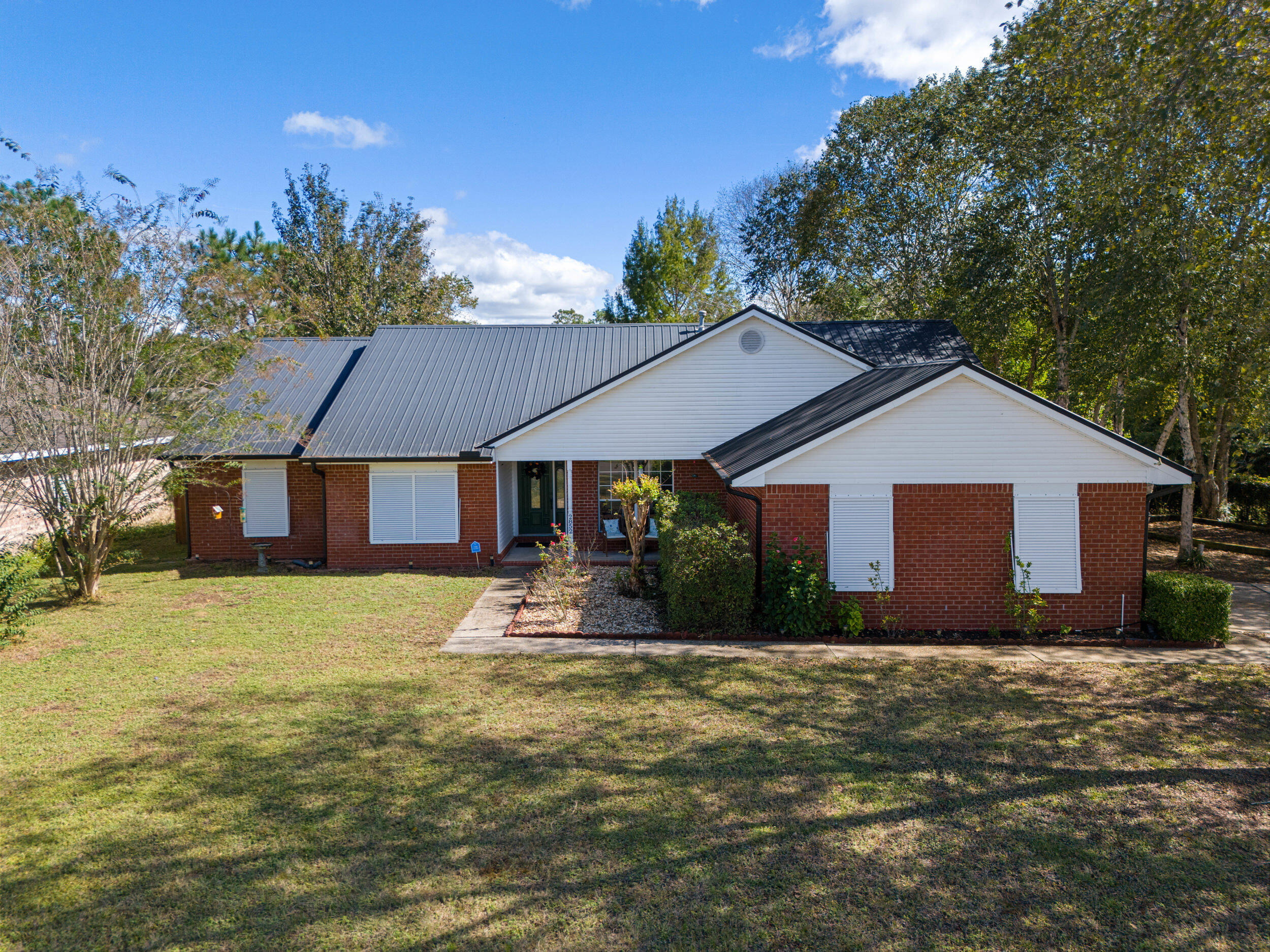 2852 Atoka Trail Crestview, FL 32539 - Photo 43 of 43 a front view of house with yard and trees in the background