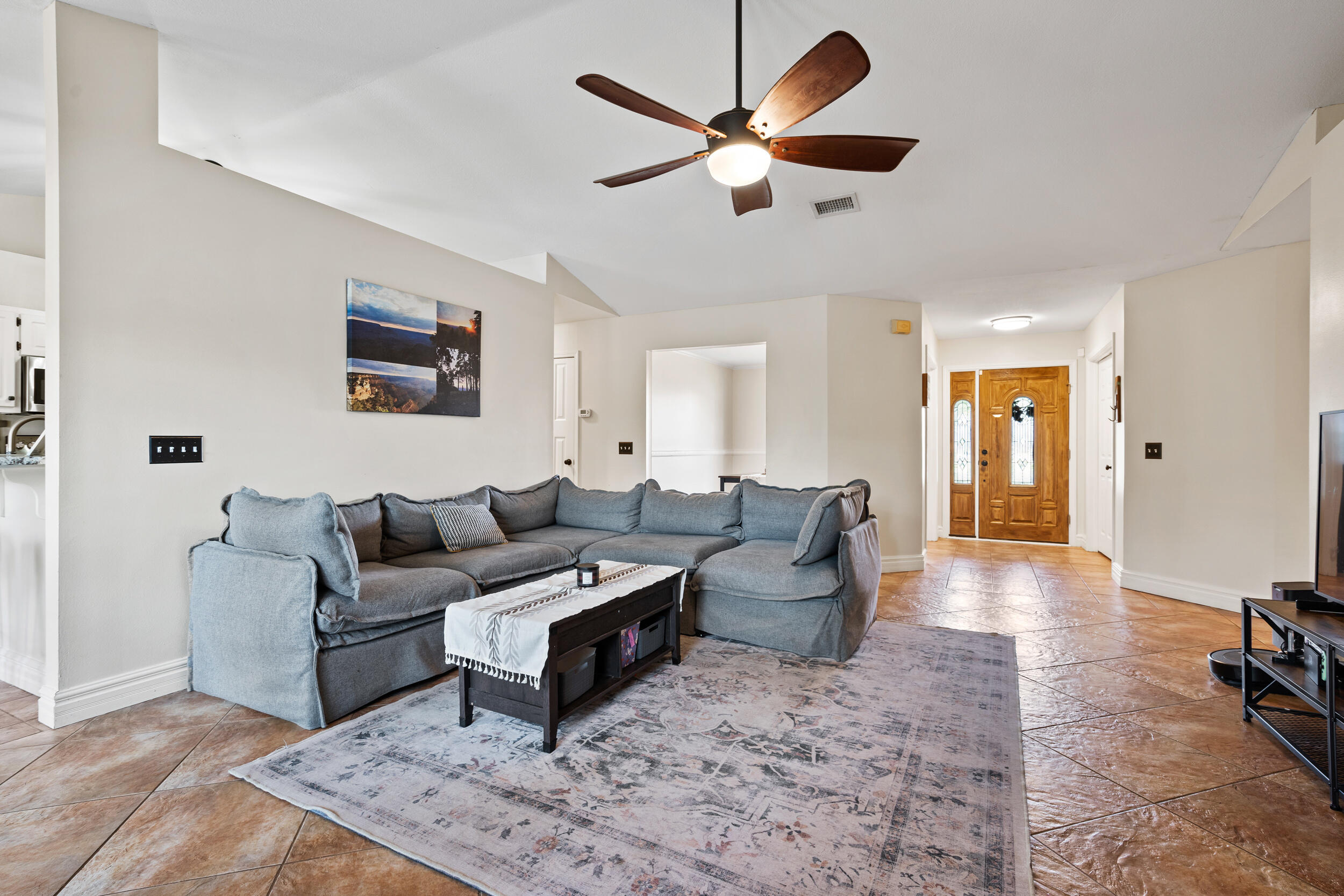 2852 Atoka Trail Crestview, FL 32539 - Photo 9 of 43 a living room with furniture wooden floor and a ceiling fan