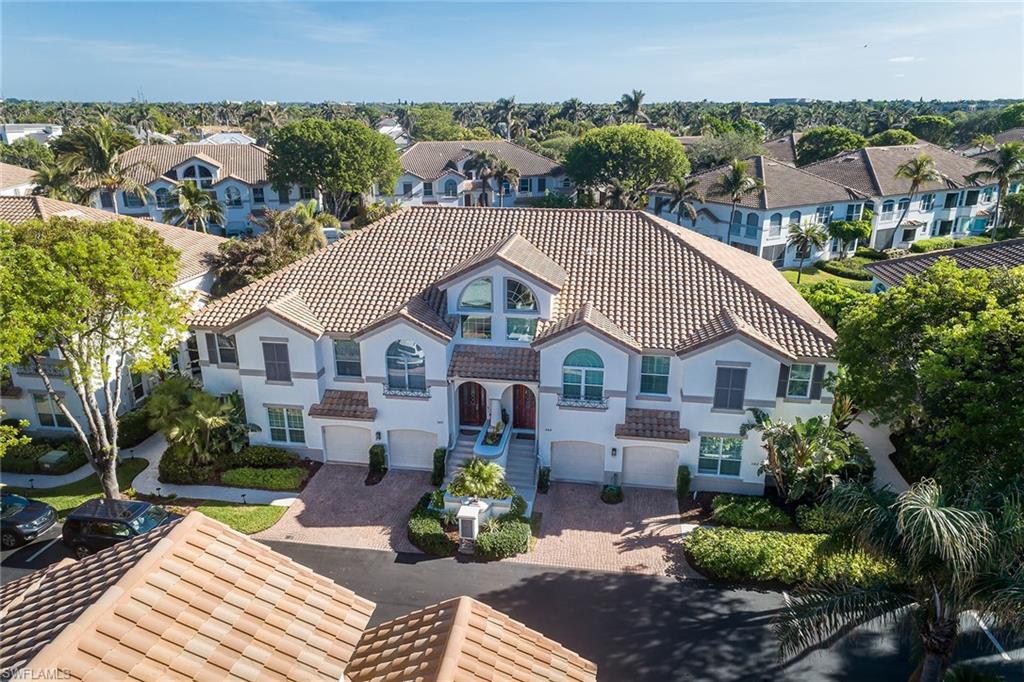 142 Colonade Circle Naples, FL 34103 - Photo 21 of 30 a front view of a house with a yard