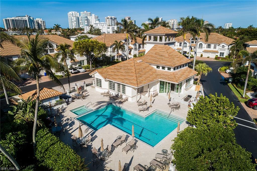 142 Colonade Circle Naples, FL 34103 - Photo 23 of 30 an aerial view of multiple houses with yard