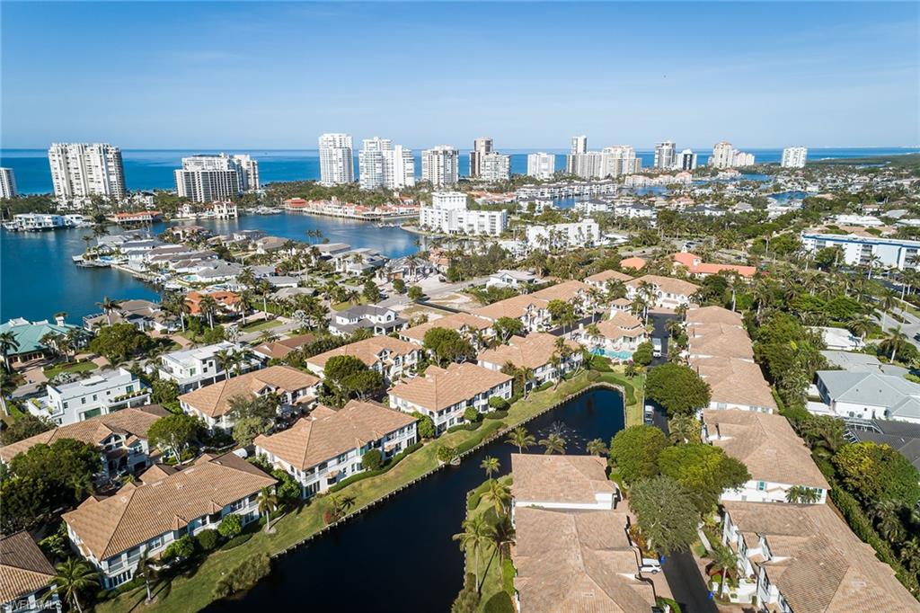 142 Colonade Circle Naples, FL 34103 - Photo 27 of 30 an aerial view of residential building and lake view