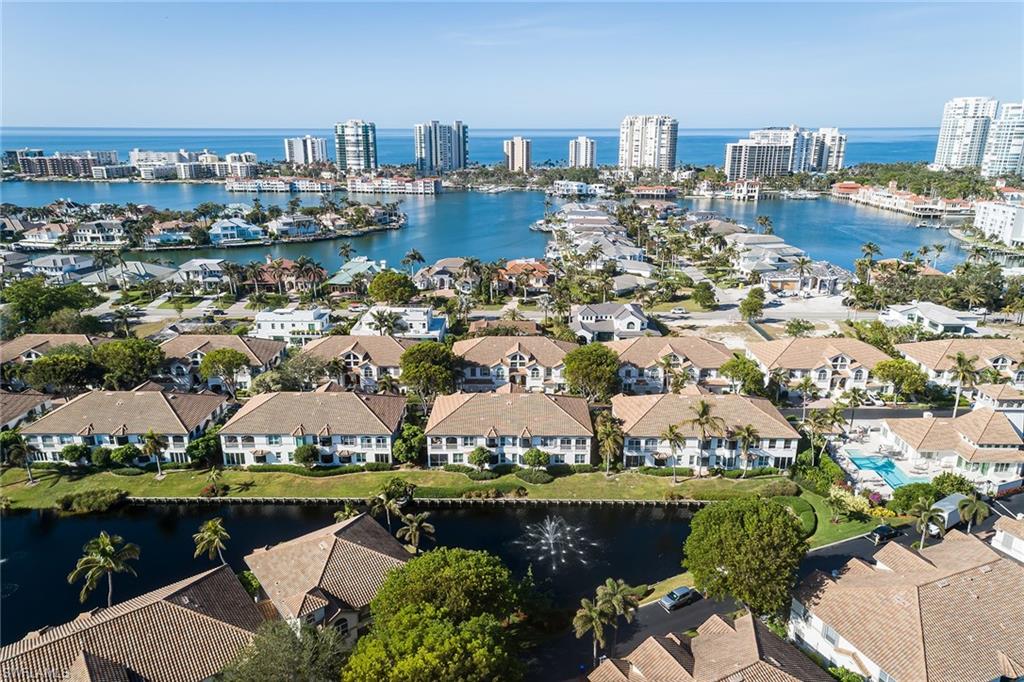 142 Colonade Circle Naples, FL 34103 - Photo 28 of 30 a view of a city with lake