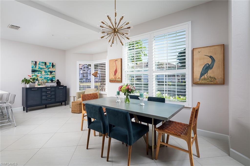 142 Colonade Circle Naples, FL 34103 - Photo 5 of 30 a view of a dining room with furniture and window