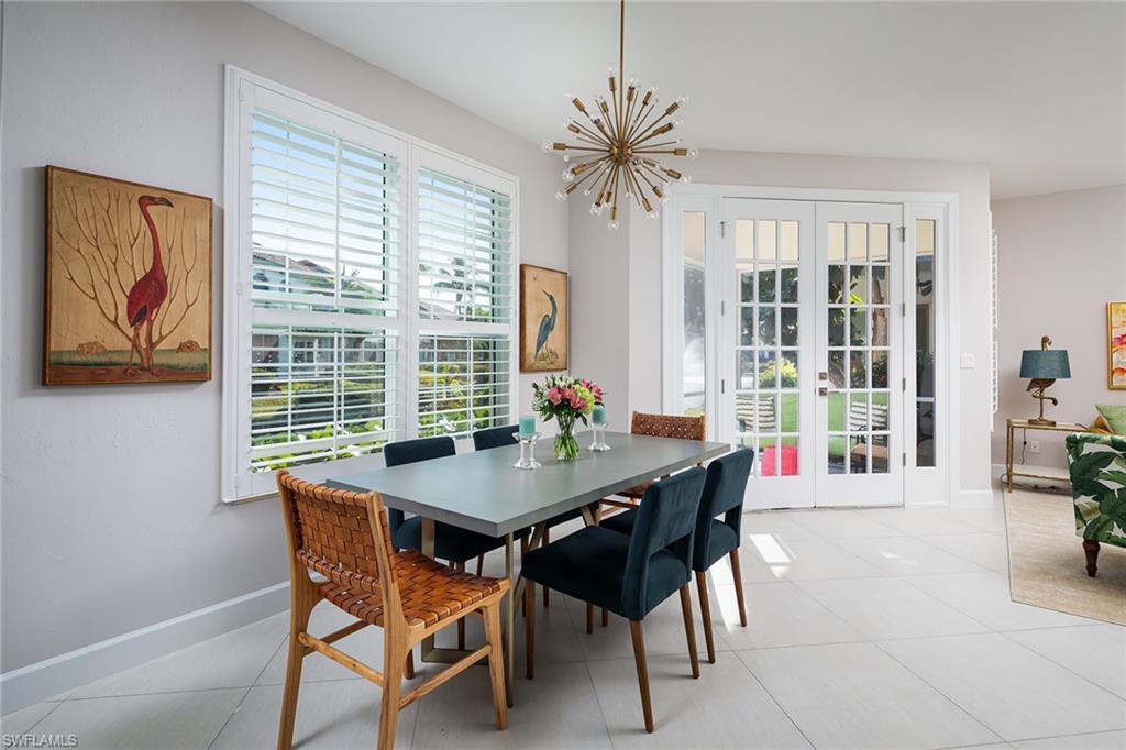 142 Colonade Circle Naples, FL 34103 - Photo 6 of 30 a view of a dining room with furniture window and outside view