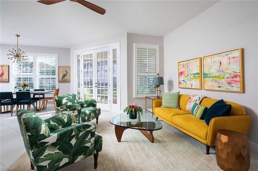 142 Colonade Circle Naples, FL 34103 - Photo 8 of 30 a living room with furniture and a large window