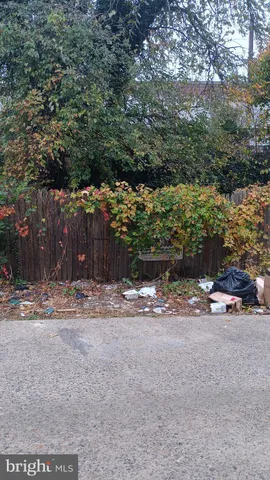 a backyard of a house with trees and houses