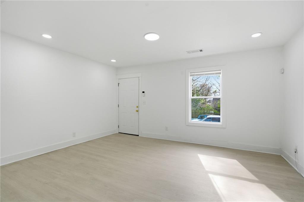 1458 Olive Street Southwest Atlanta, GA 30310 - Photo 15 of 38 an empty room with windows