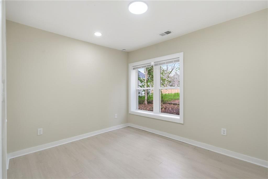 1458 Olive Street Southwest Atlanta, GA 30310 - Photo 16 of 38 an empty room with windows