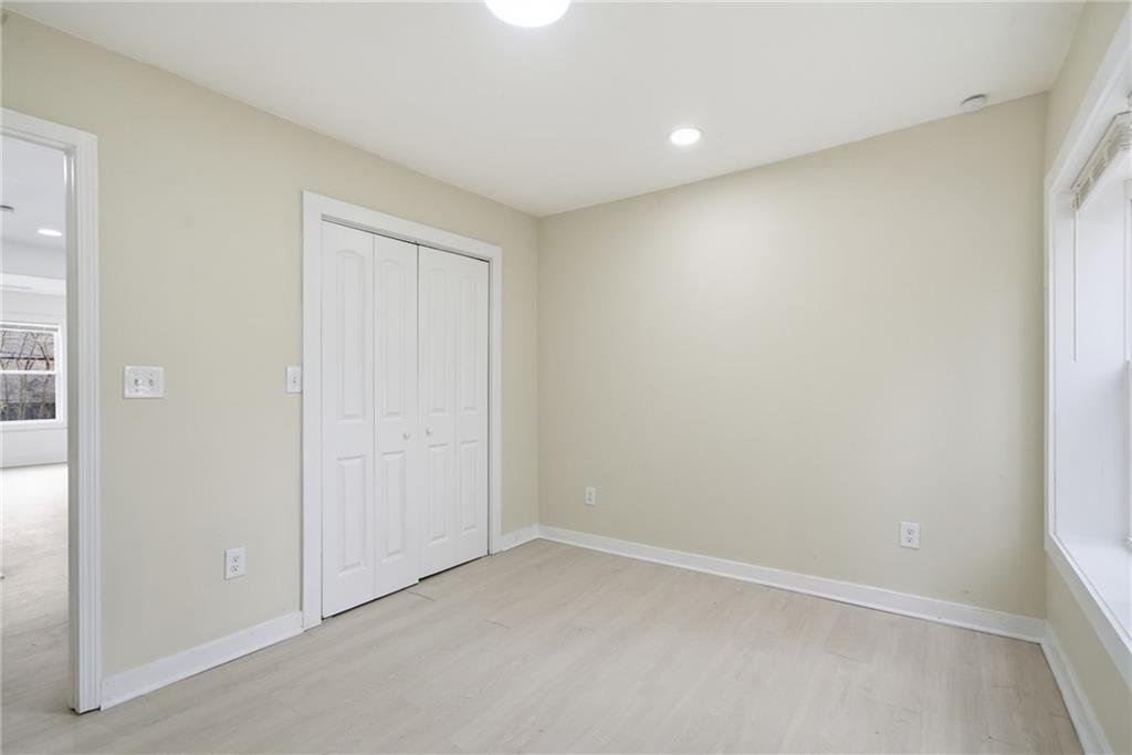 1458 Olive Street Southwest Atlanta, GA 30310 - Photo 17 of 38 an empty room with a empty space and windows