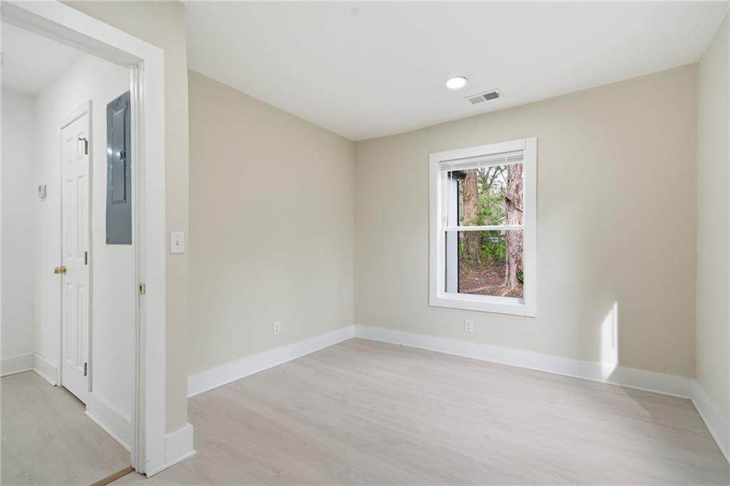 1458 Olive Street Southwest Atlanta, GA 30310 - Photo 22 of 38 an empty room with windows