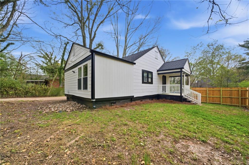 1458 Olive Street Southwest Atlanta, GA 30310 - Photo 27 of 38 a backyard of a house with lots of green space