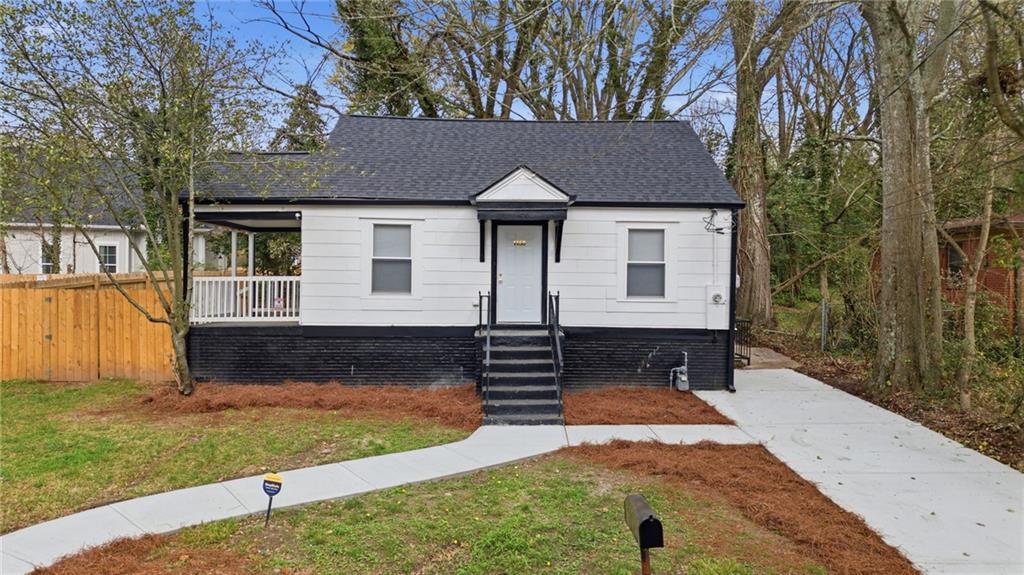 1458 Olive Street Southwest Atlanta, GA 30310 - Photo 29 of 38 a front view of a house with garden