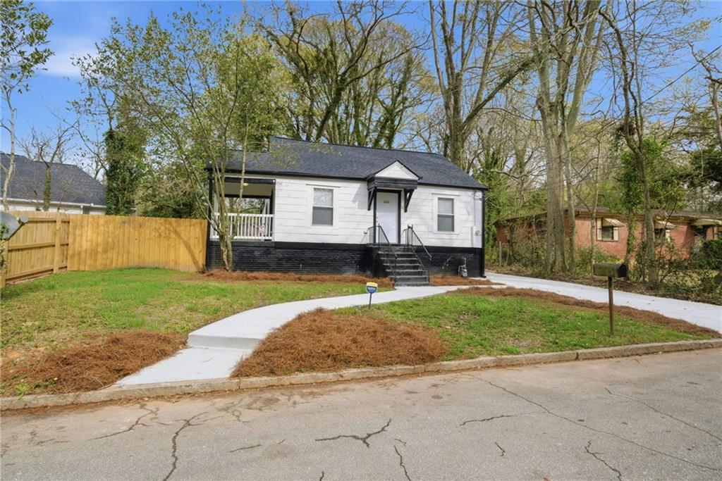 1458 Olive Street Southwest Atlanta, GA 30310 - Photo 30 of 38 a view of a house with a backyard