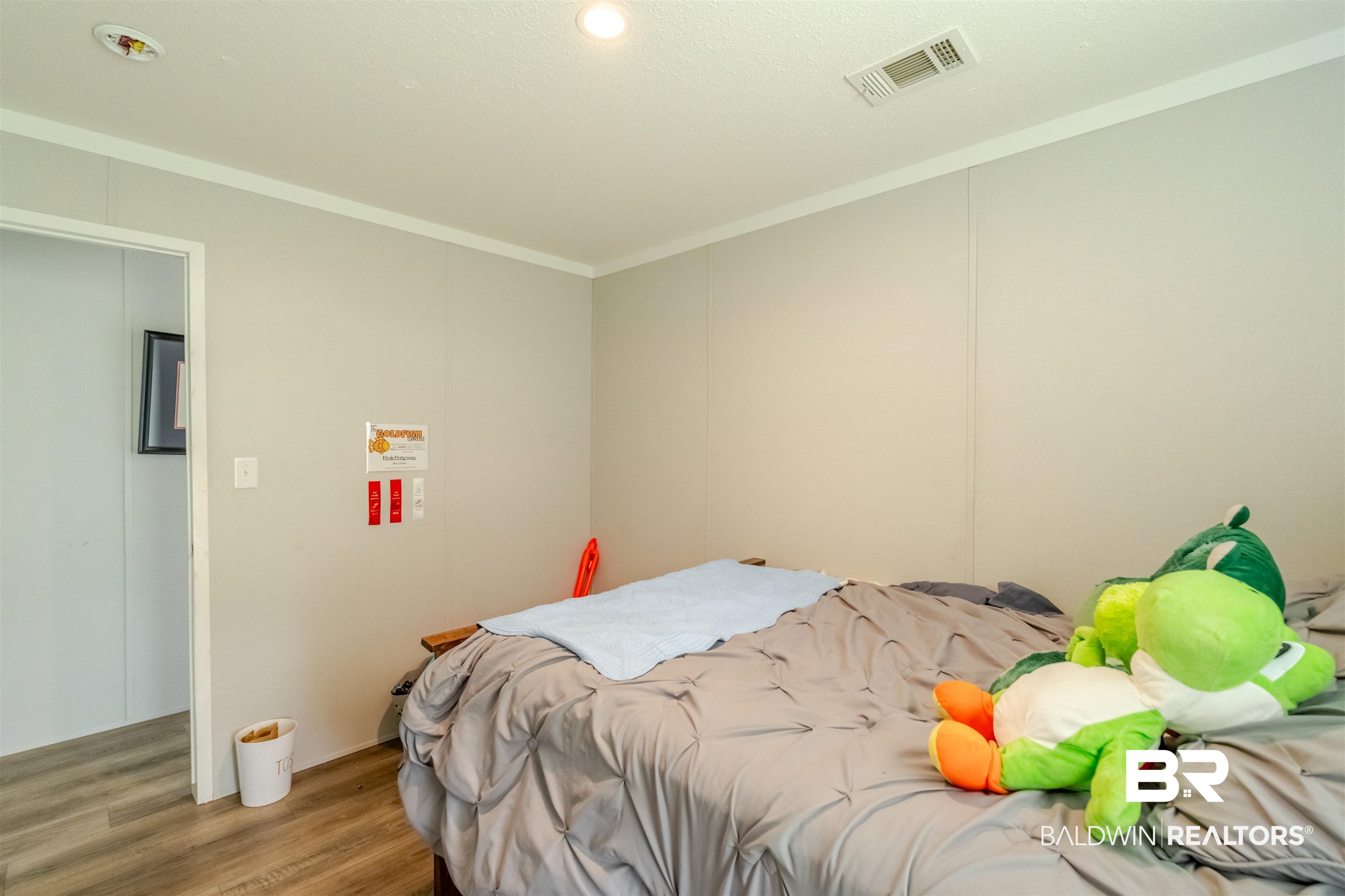 15575 Mikkelsen Road Summerdale, AL 36580 - Photo 24 of 68 Room featuring light-colored walls and wood-finish flooring