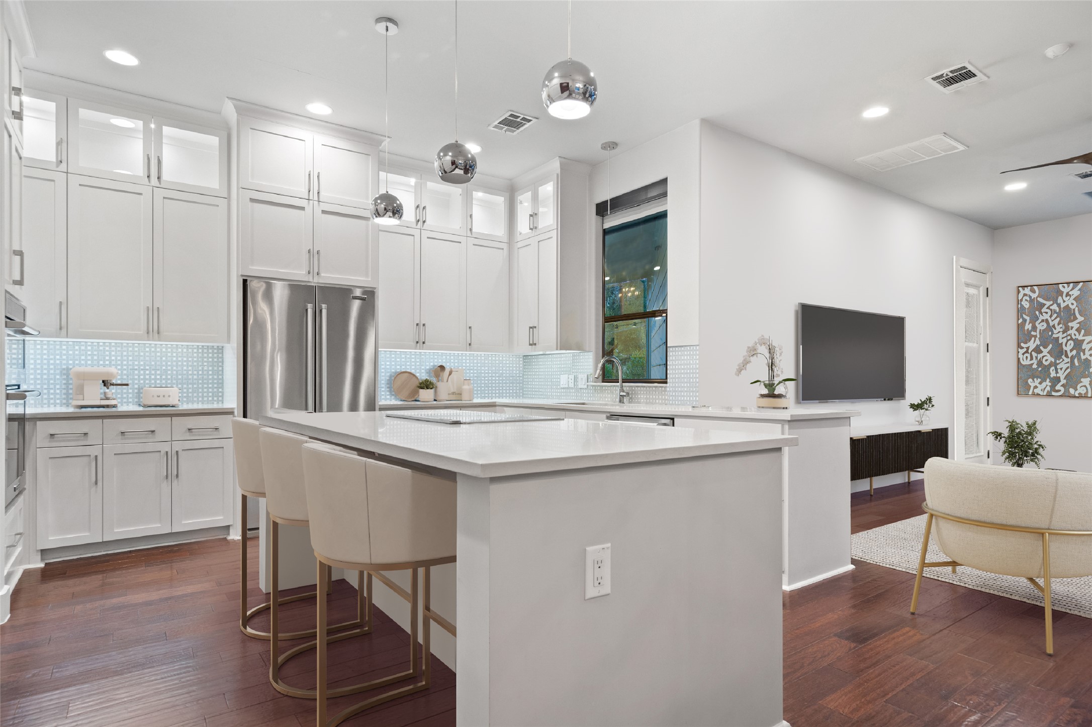 2811 Del Curto Road, Unit A Austin, TX 78704 - Photo 13 of 40 a kitchen with a sink and chairs