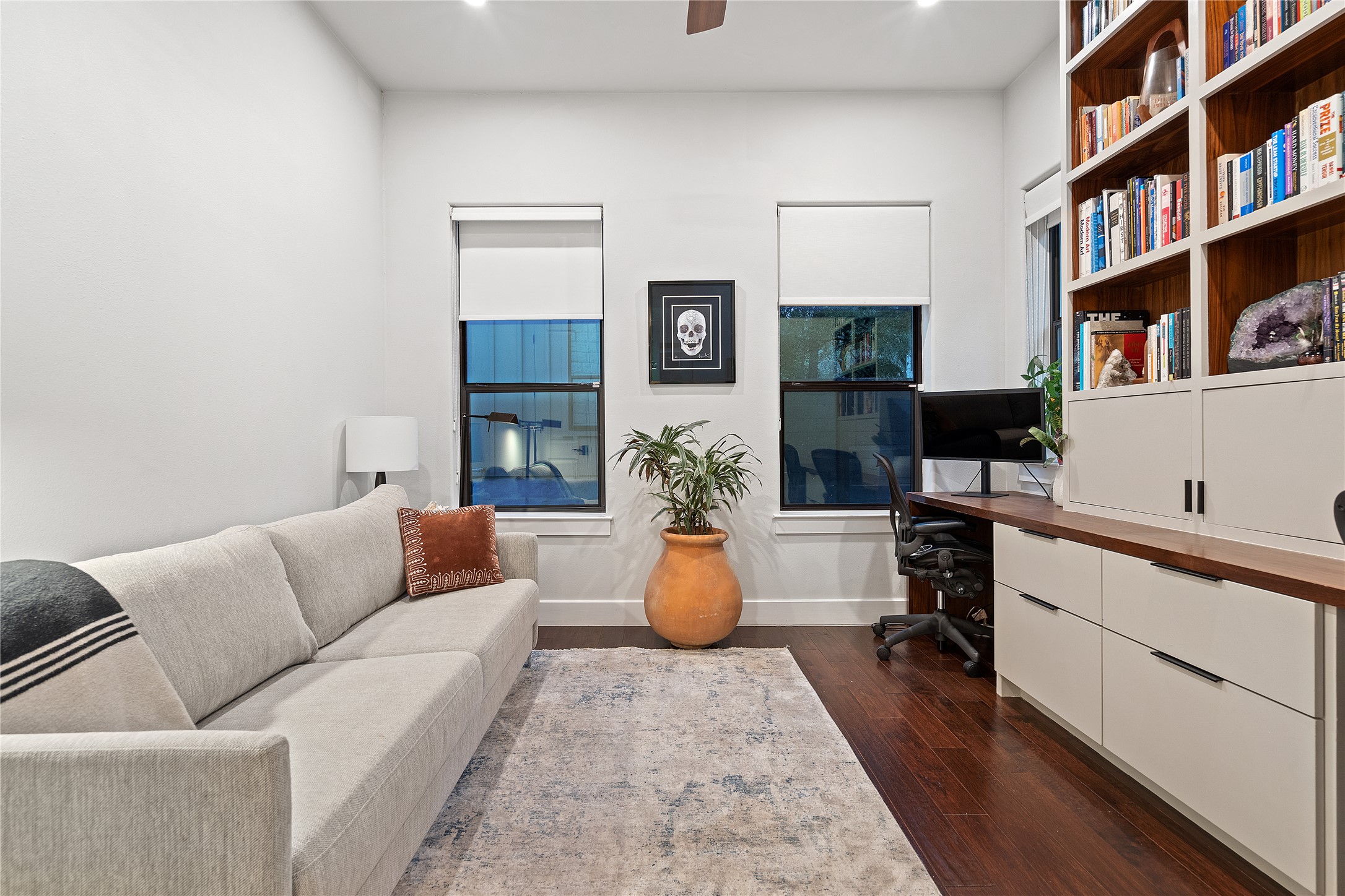 2811 Del Curto Road, Unit A Austin, TX 78704 - Photo 16 of 40 a living room with furniture and a book shelf