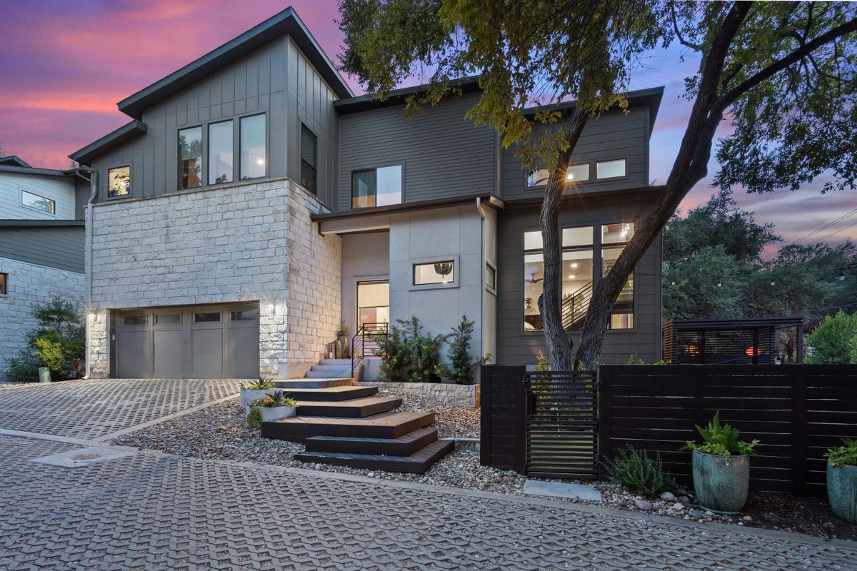 2811 Del Curto Road, Unit A Austin, TX 78704 - Photo 2 of 40 a front view of a house with a garden