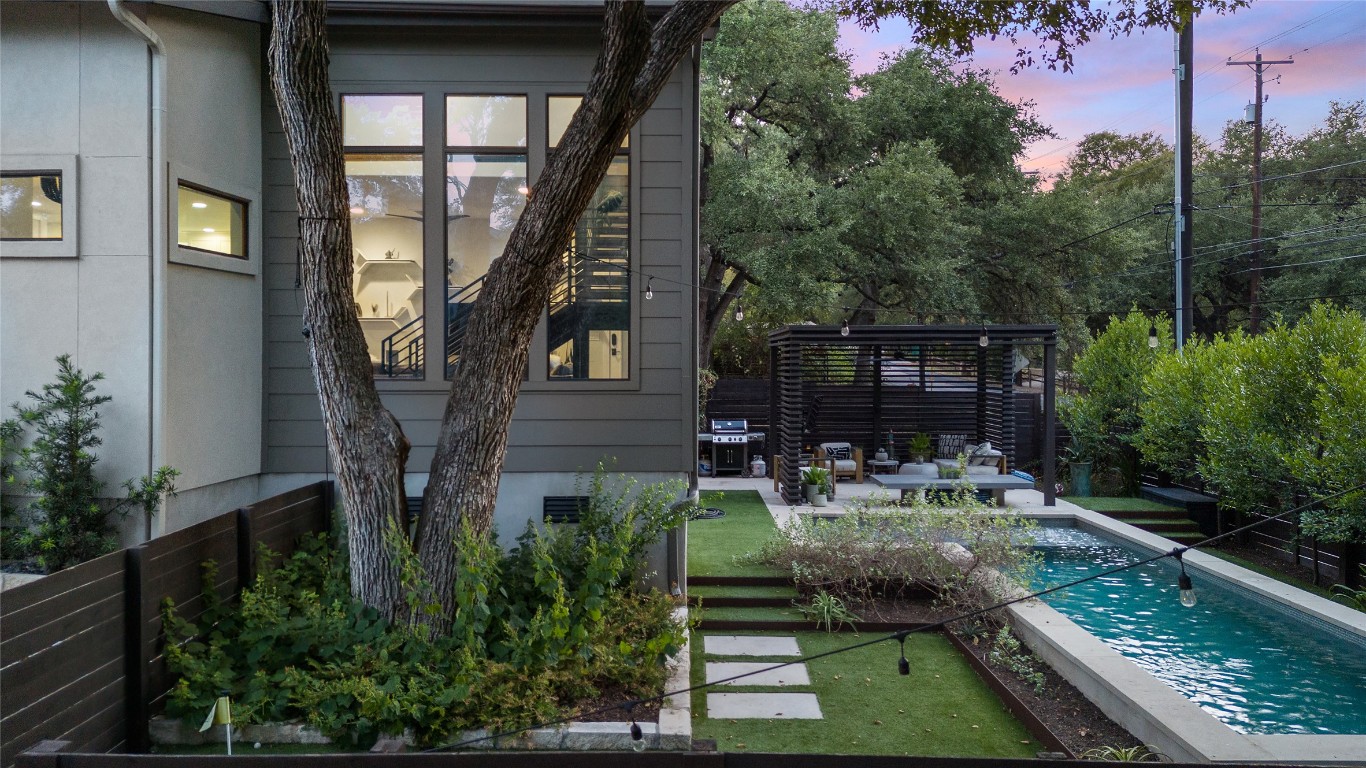 2811 Del Curto Road, Unit A Austin, TX 78704 - Photo 31 of 40 Rear view of house featuring a patio, stucco siding, view of wooded area, and a gazebo