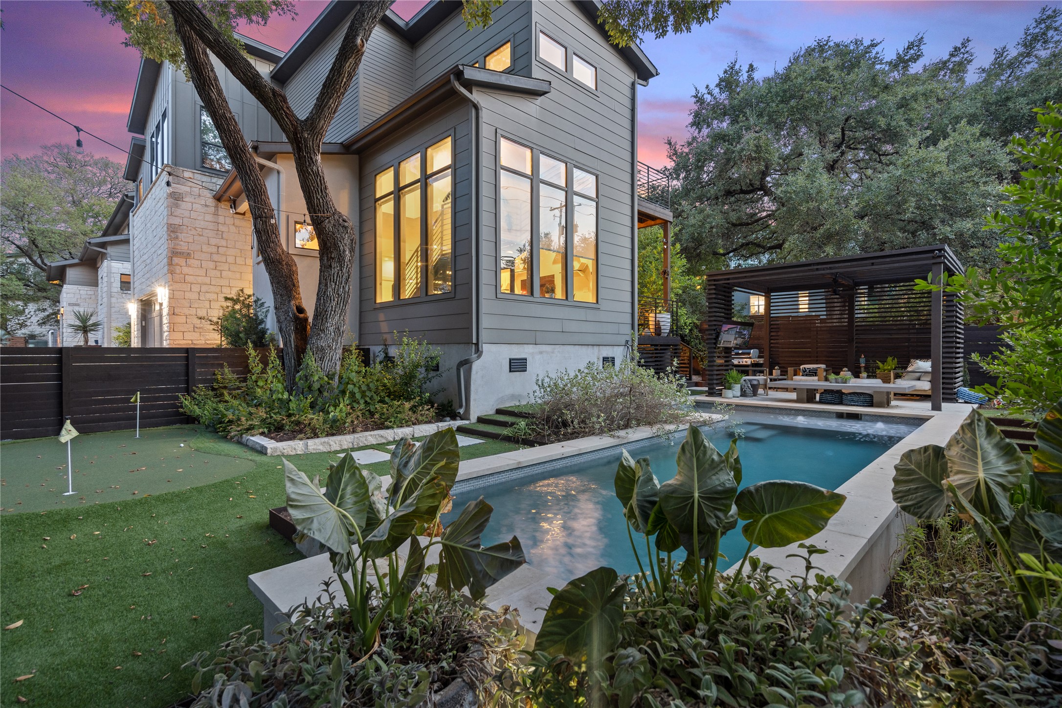 2811 Del Curto Road, Unit A Austin, TX 78704 - Photo 32 of 40 a swimming pool with outdoor seating and plants