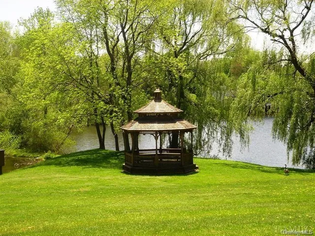 a view of a golf course with a lake view